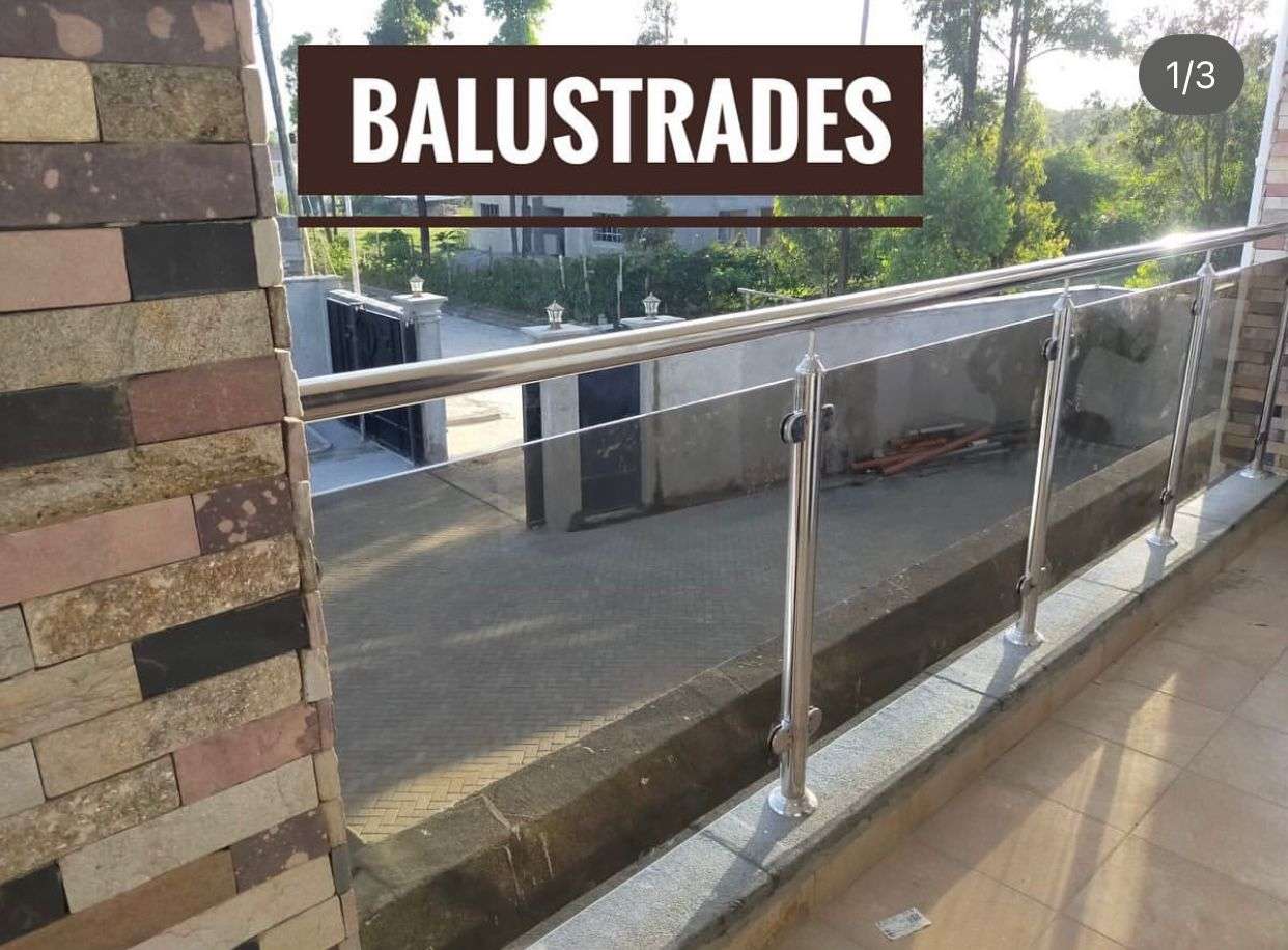 supply and installation of balcony railing compromising of stainless steel balustrade posts and tempered/ laminated glass partitions in nairobi kenya by top construction and finishing experts aura renovations and interiors