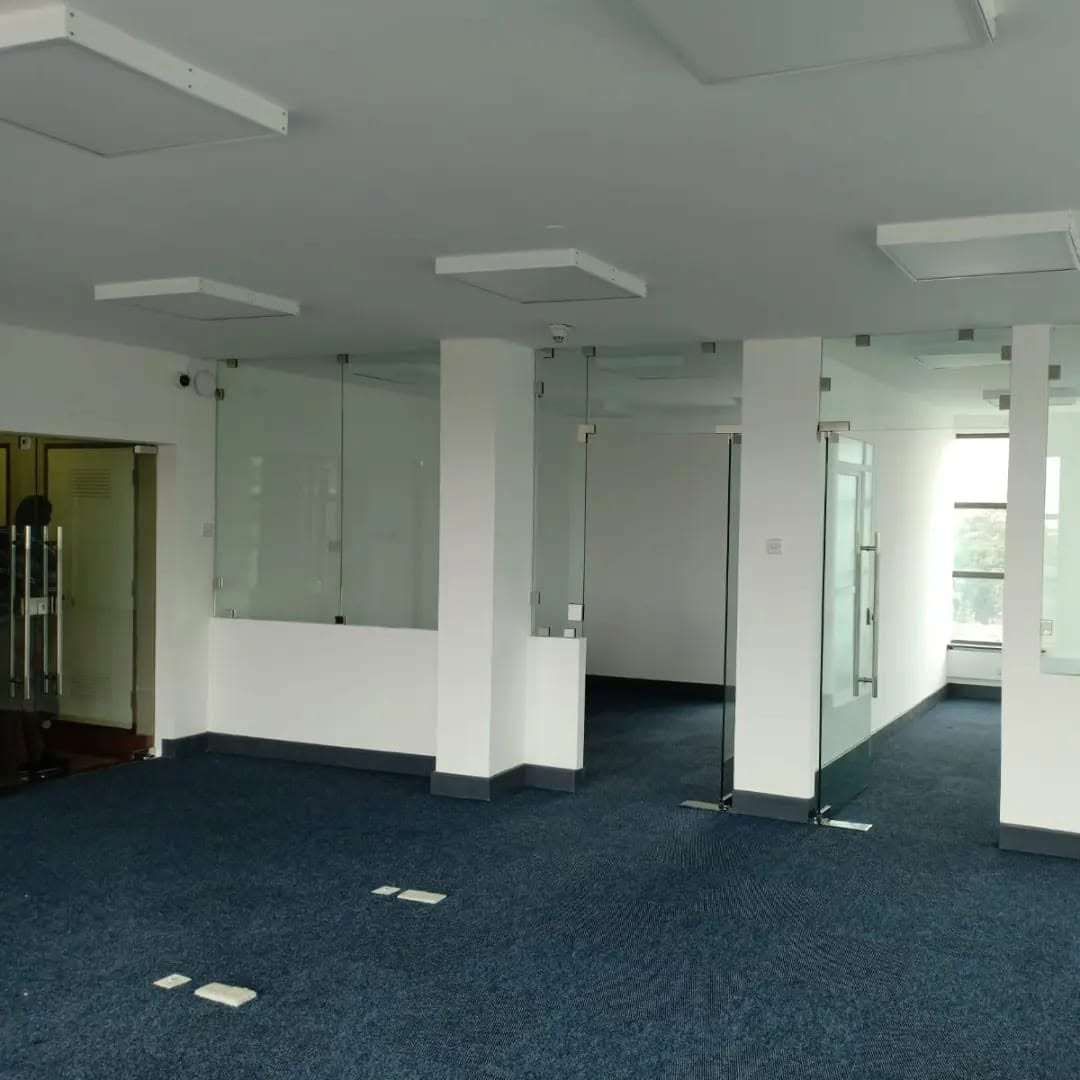 Modern office glass partition systems installed in a contemporary corporate office by Aura Renovations and Interiors.