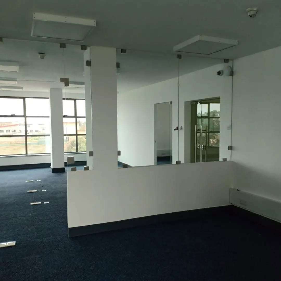 Modern office glass partition systems installed in a contemporary corporate office by Aura Renovations and Interiors.